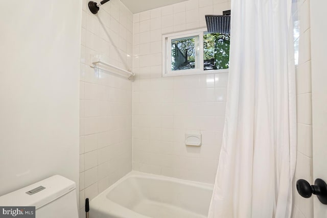 bathroom featuring toilet and shower / bath combo