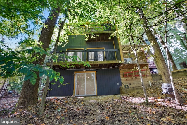 back of house with a balcony