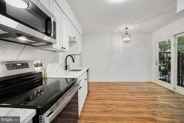 kitchen with white cabinets, stainless steel appliances, and sink