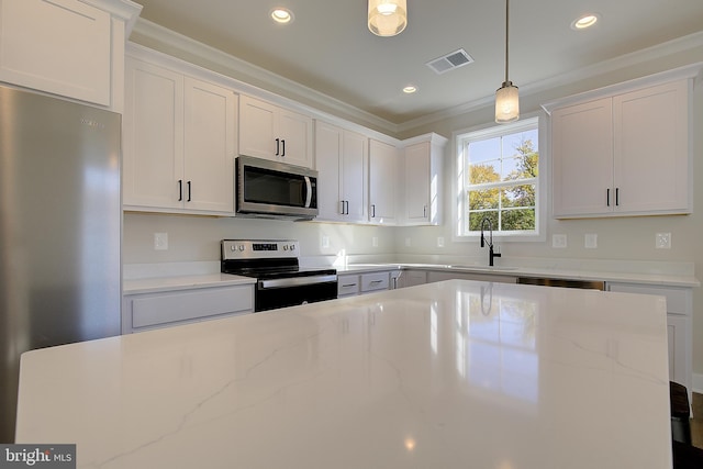 kitchen featuring appliances with stainless steel finishes and white cabinetry