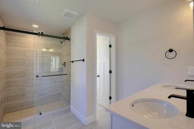 bathroom with vanity and an enclosed shower