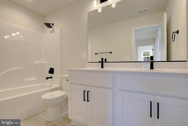 full bathroom with vanity, toilet, and shower / tub combination