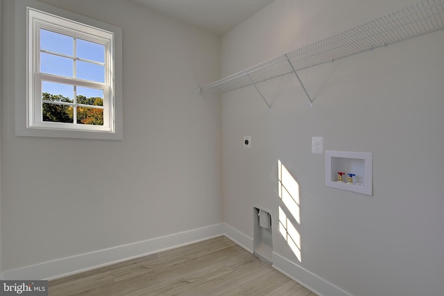 laundry area featuring hookup for an electric dryer, hookup for a washing machine, and light wood-type flooring