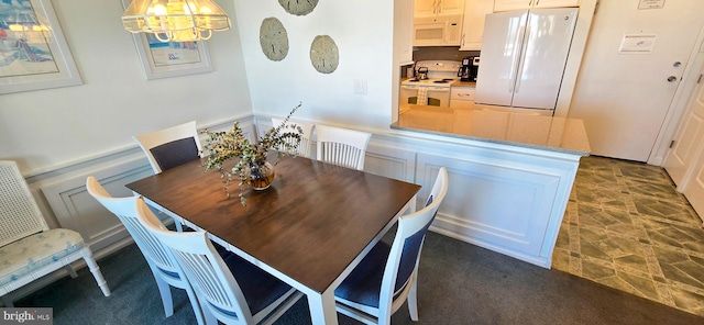 dining room with a chandelier