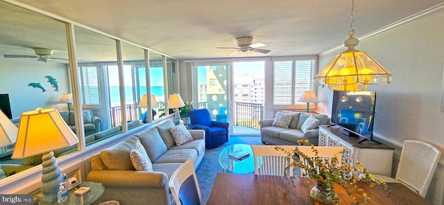 living room with floor to ceiling windows, ceiling fan, and ornamental molding