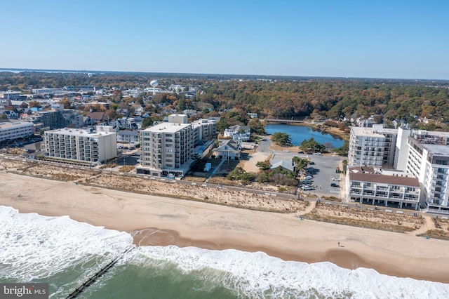 aerial view featuring a water view and a beach view