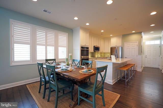 dining room with dark wood-type flooring