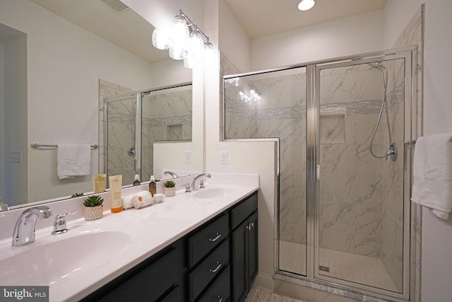 bathroom with vanity and an enclosed shower