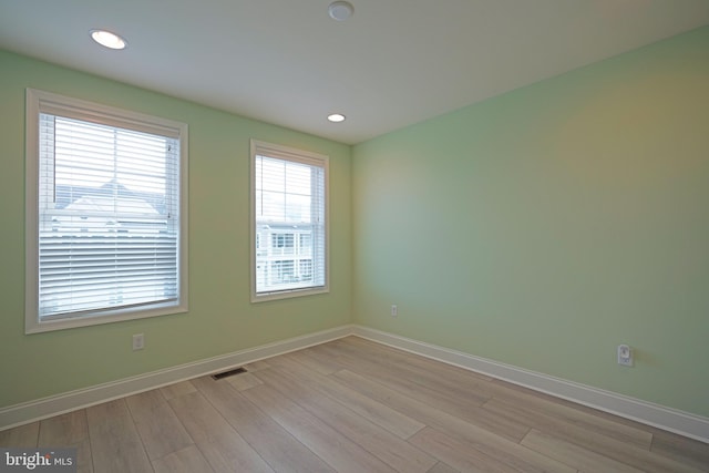 unfurnished room featuring light wood-type flooring