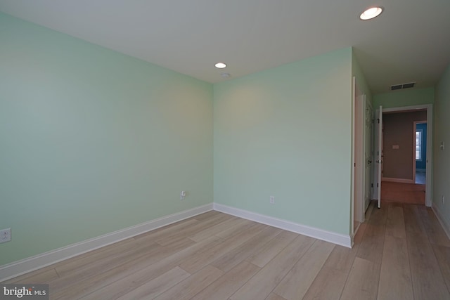 spare room with light wood-type flooring