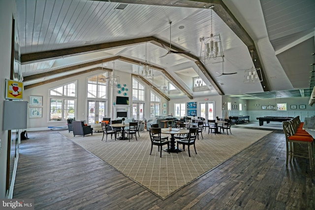 dining space with high vaulted ceiling, hardwood / wood-style flooring, beamed ceiling, wooden ceiling, and ceiling fan