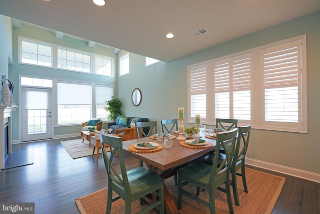 dining room with dark hardwood / wood-style flooring