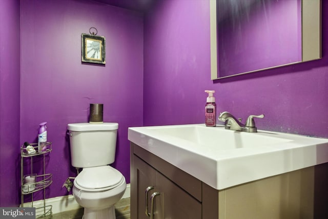 bathroom with toilet and vanity