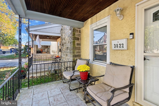 view of patio featuring a porch