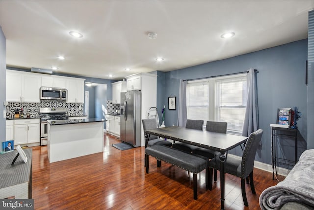 dining space featuring hardwood / wood-style floors