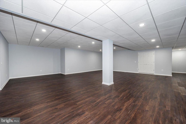finished below grade area with wood finished floors, baseboards, and recessed lighting