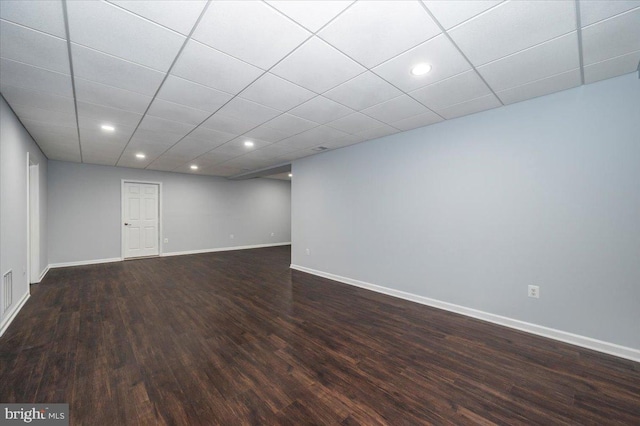 interior space with dark wood-type flooring, baseboards, and recessed lighting