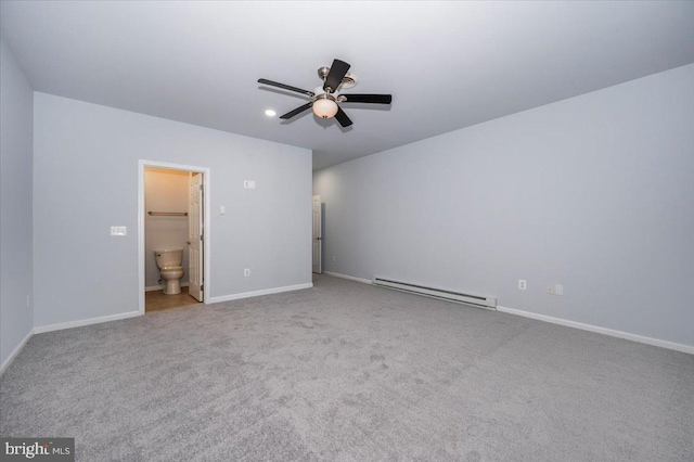 unfurnished bedroom featuring a baseboard heating unit, carpet, ensuite bath, a ceiling fan, and baseboards