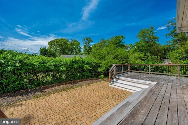 wooden deck with a patio