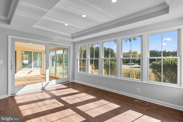 unfurnished sunroom with a raised ceiling and a wealth of natural light