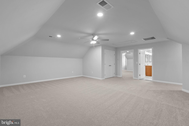 bonus room featuring light colored carpet, ceiling fan, and lofted ceiling