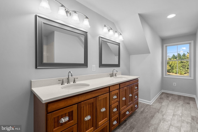 bathroom featuring hardwood / wood-style floors and vanity