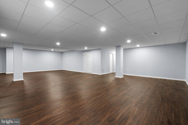 basement featuring dark hardwood / wood-style floors