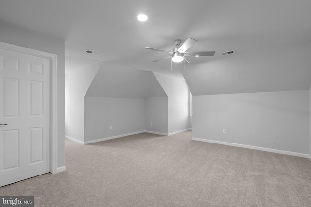 bonus room featuring carpet, visible vents, baseboards, and lofted ceiling