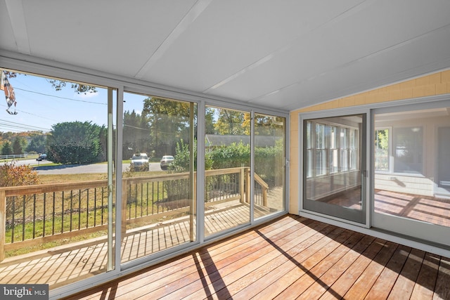 sunroom / solarium with lofted ceiling