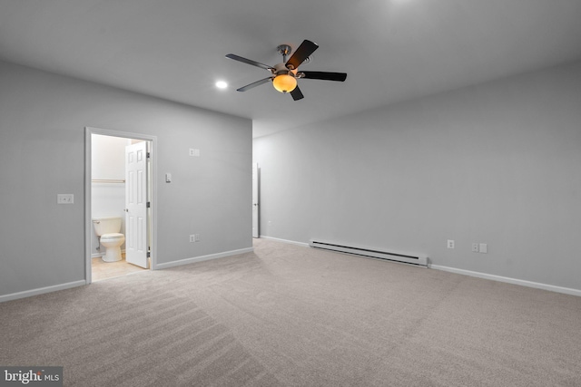 interior space with ceiling fan, baseboards, and a baseboard heating unit
