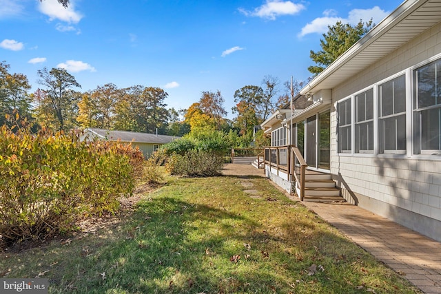 view of yard featuring a wooden deck