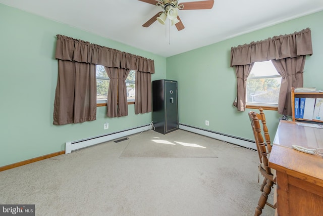 interior space featuring a baseboard heating unit, light carpet, and plenty of natural light