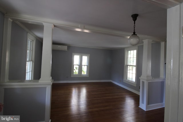 interior space with ornamental molding, a wall mounted air conditioner, and dark hardwood / wood-style floors