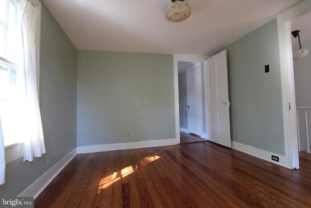 empty room featuring dark hardwood / wood-style floors