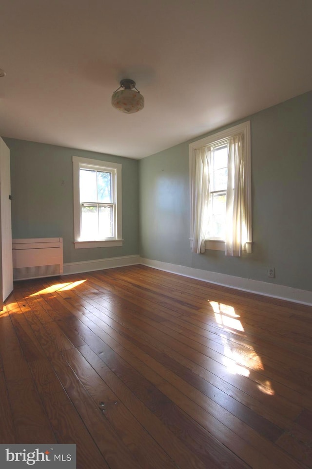 spare room featuring dark hardwood / wood-style floors