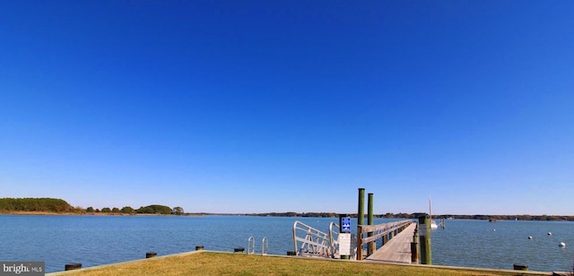 dock area featuring a water view