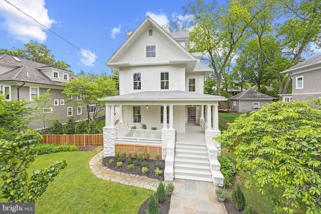 view of front of home featuring a front lawn and a porch