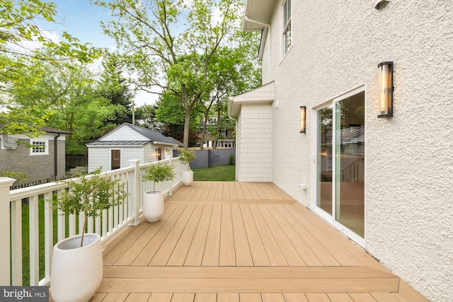 wooden terrace with a shed