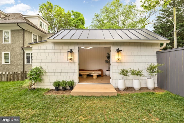 view of outdoor structure with a lawn