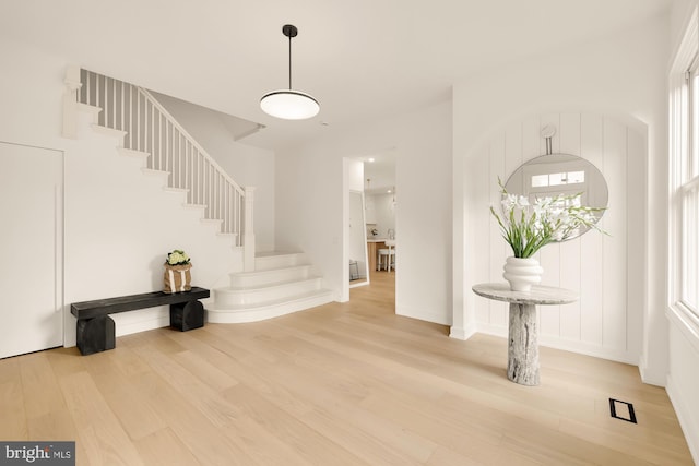 entryway with light hardwood / wood-style flooring