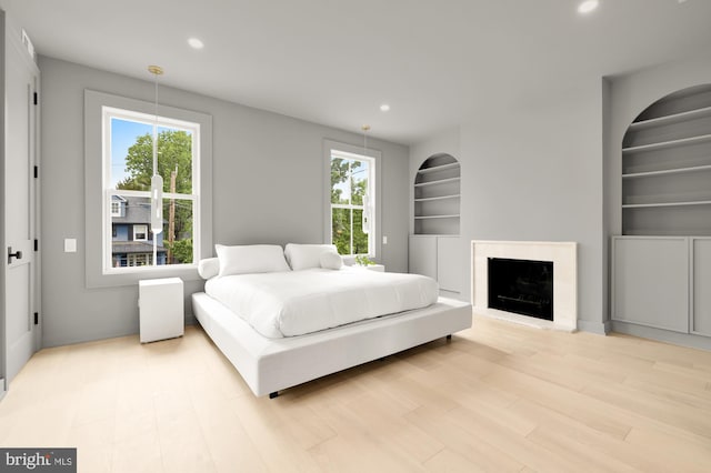 bedroom with light hardwood / wood-style floors