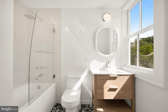 full bathroom featuring tile patterned floors, vanity, toilet, and shower / bath combination with glass door