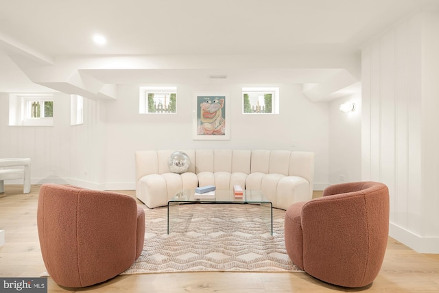 living room with plenty of natural light and light wood-type flooring