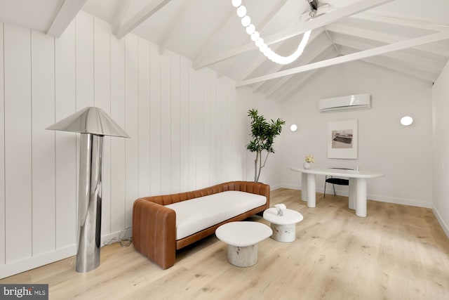 sitting room with a wall mounted air conditioner, vaulted ceiling with beams, light hardwood / wood-style floors, and wood walls