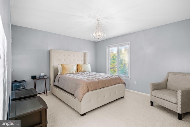 bedroom with a notable chandelier and carpet flooring