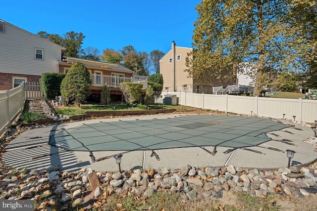 view of swimming pool featuring a deck