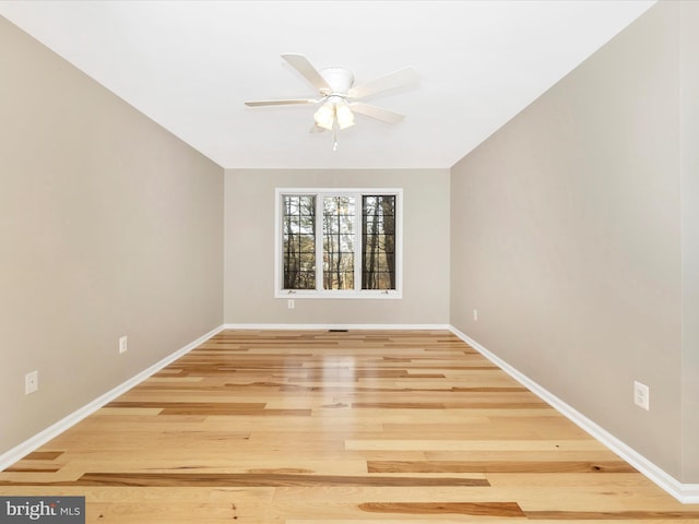 empty room with hardwood / wood-style flooring and ceiling fan