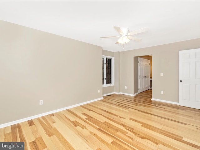 spare room featuring ceiling fan and hardwood / wood-style flooring