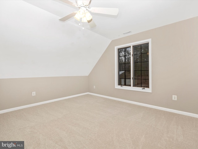 additional living space with carpet flooring, ceiling fan, and lofted ceiling