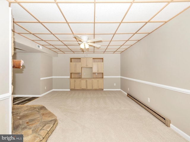 unfurnished living room with ceiling fan, light colored carpet, and a baseboard radiator